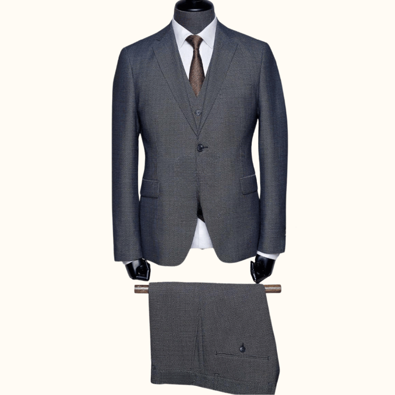 Sodobna moška tridelna slim fit obleka T4915 v temno sivi barvi z oxford tkanjem, izdelana iz kakovostne mešanice volne, poliestra in elastana. Popolna izbira za poslovne in svečane priložnosti.